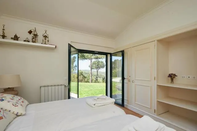Bedroom with doors to the lawn