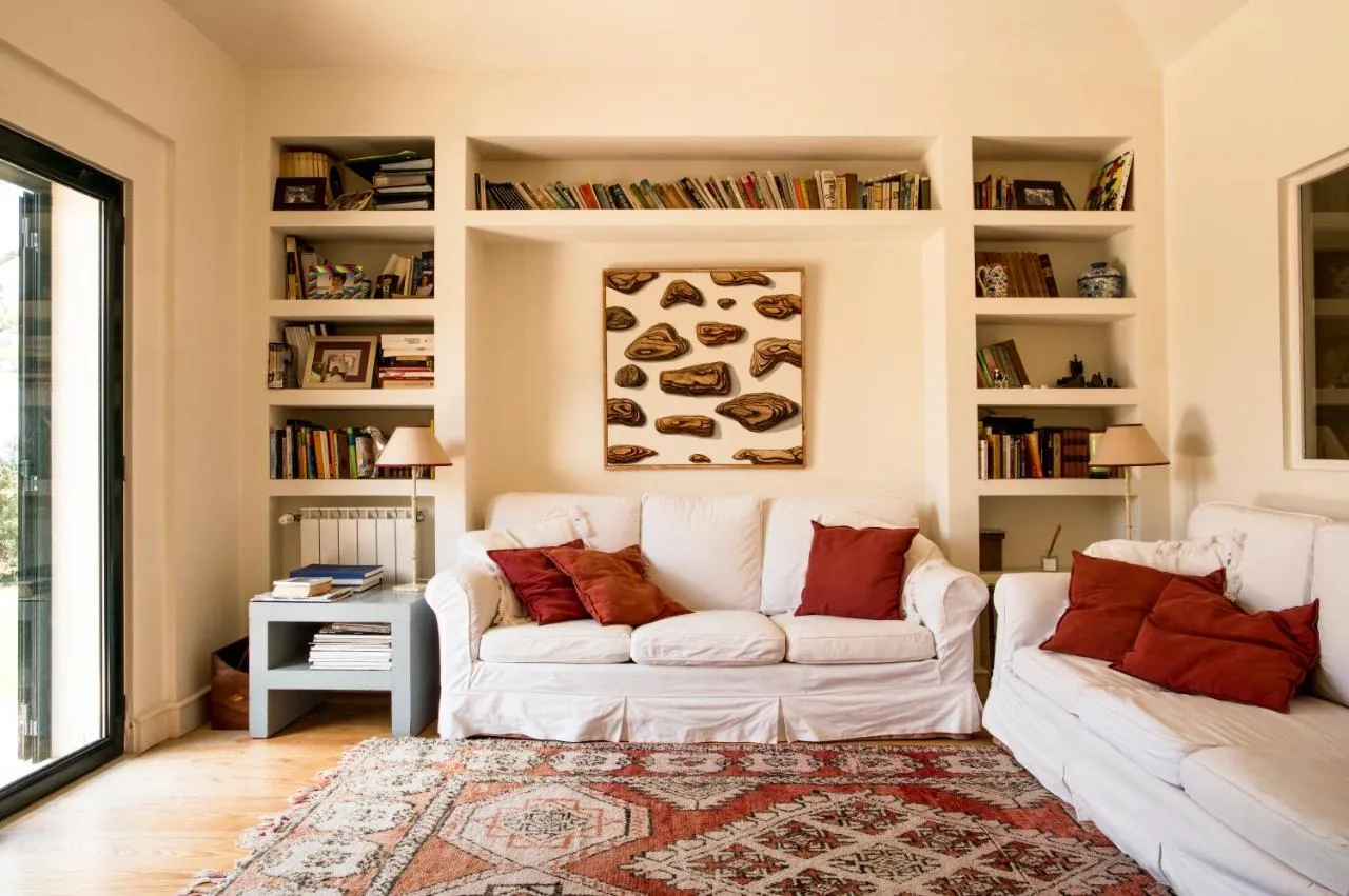 Sitting room with library at Villa Rio Seco